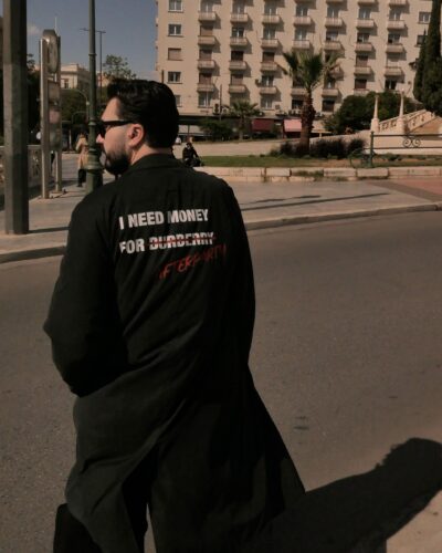 Black unisex Power Trench Coat with statement back print by Afterparty