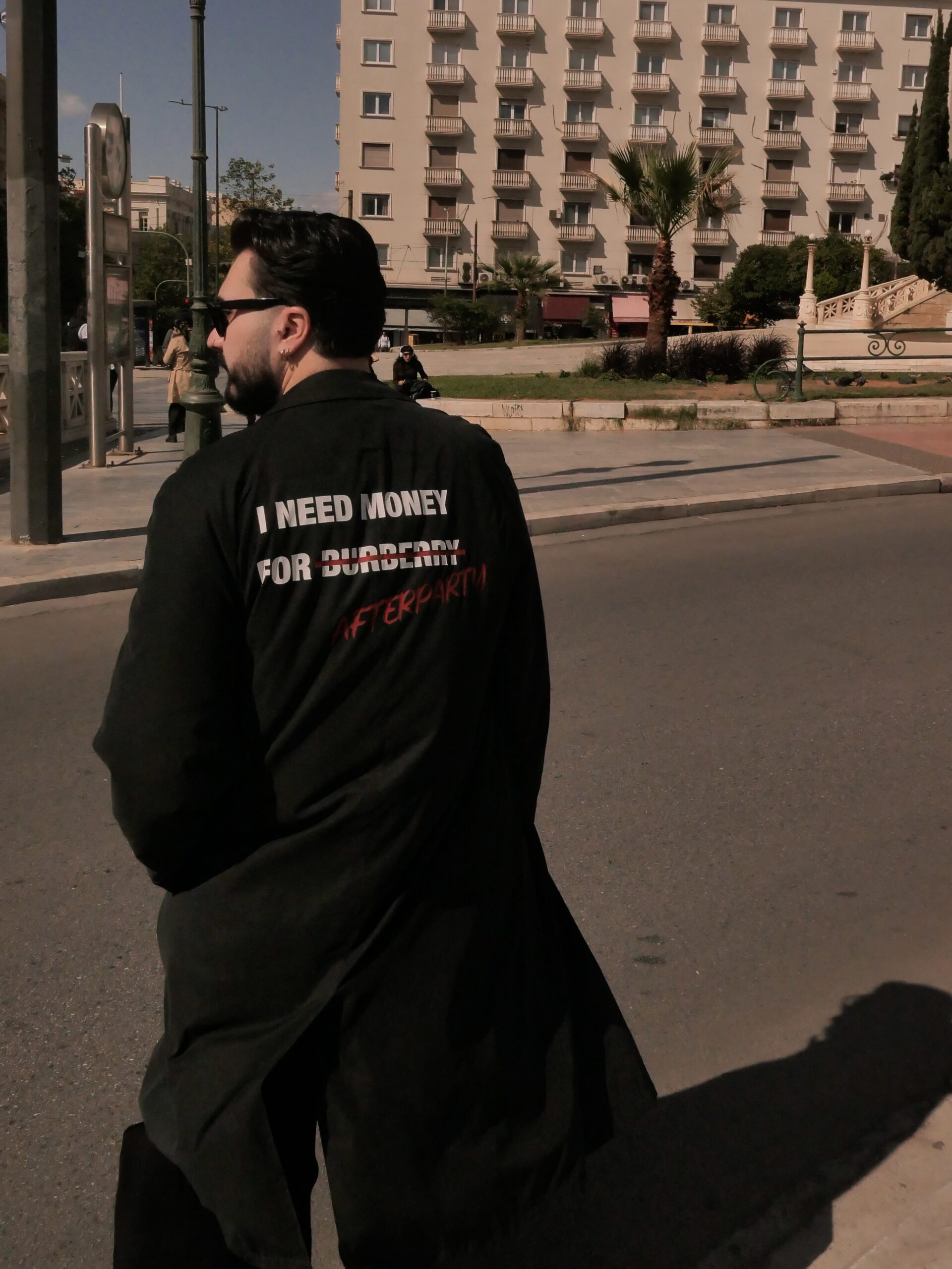Black unisex Power Trench Coat with statement back print by Afterparty