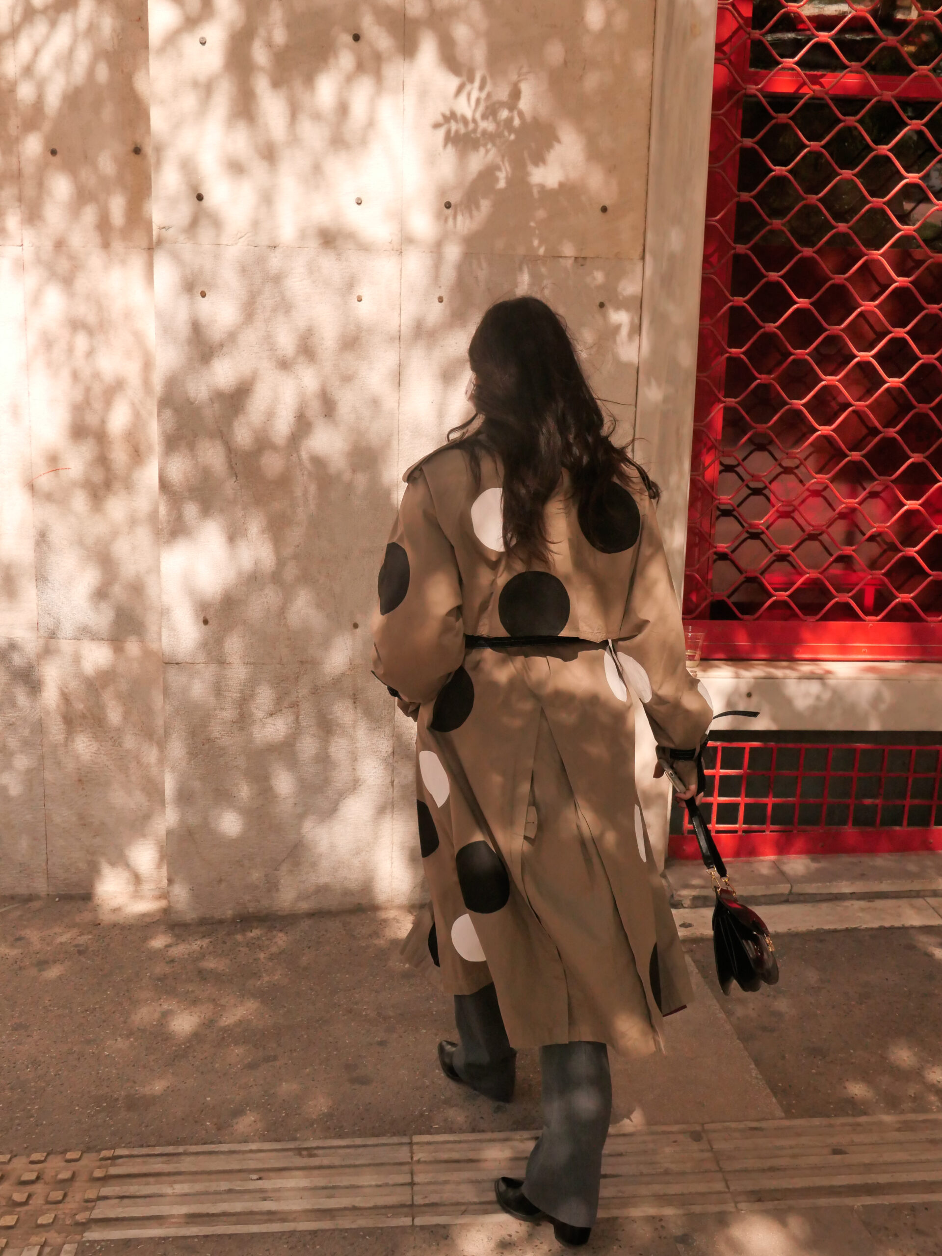 Back view of khaki Polka Trench Coat with hand-painted dots