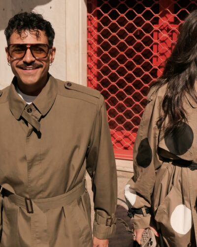 Front view of khaki tailored trench coat with structured shoulders