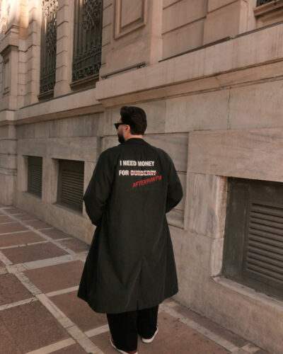Black unisex Power Trench Coat with statement back print by Afterparty