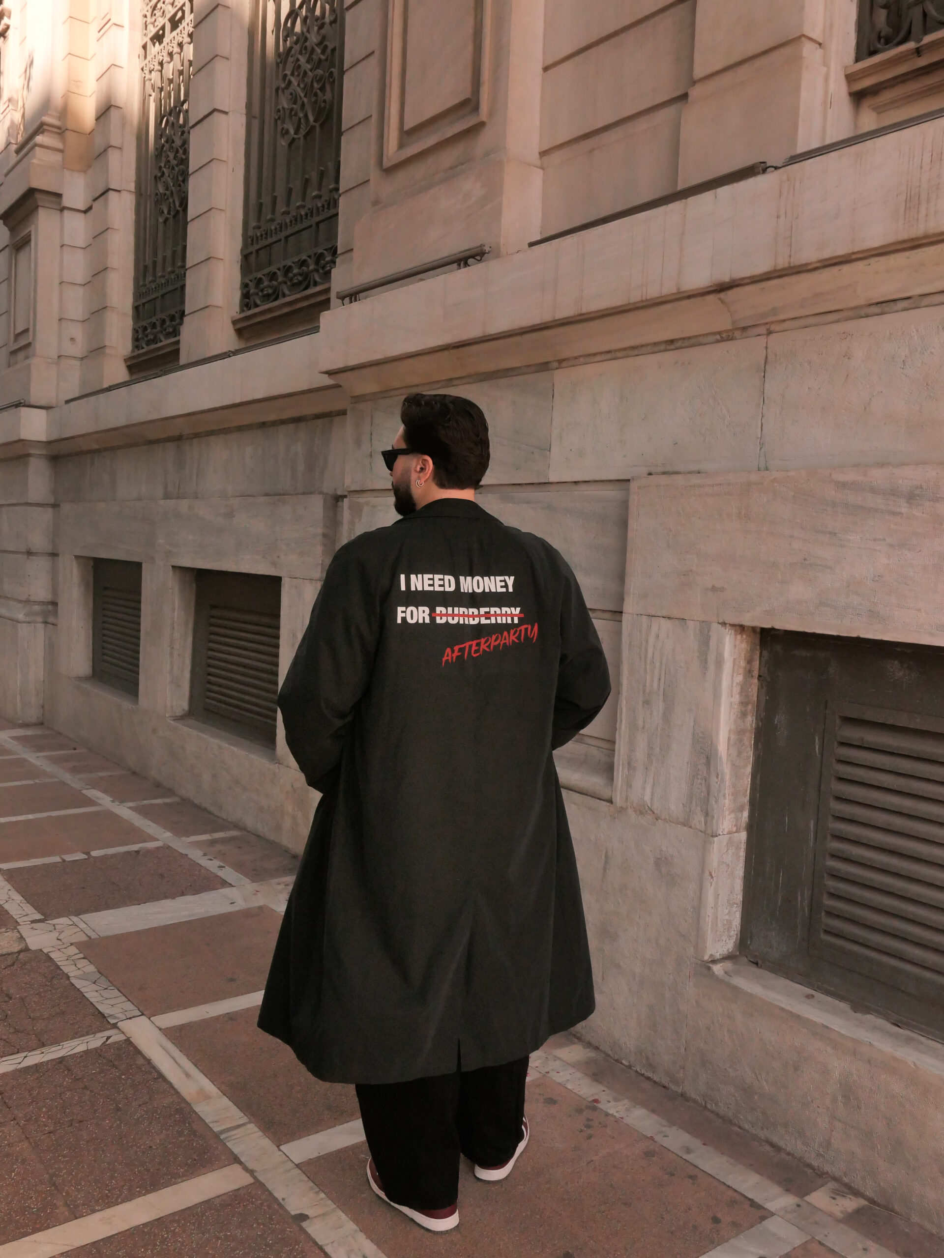 Black unisex Power Trench Coat with statement back print by Afterparty